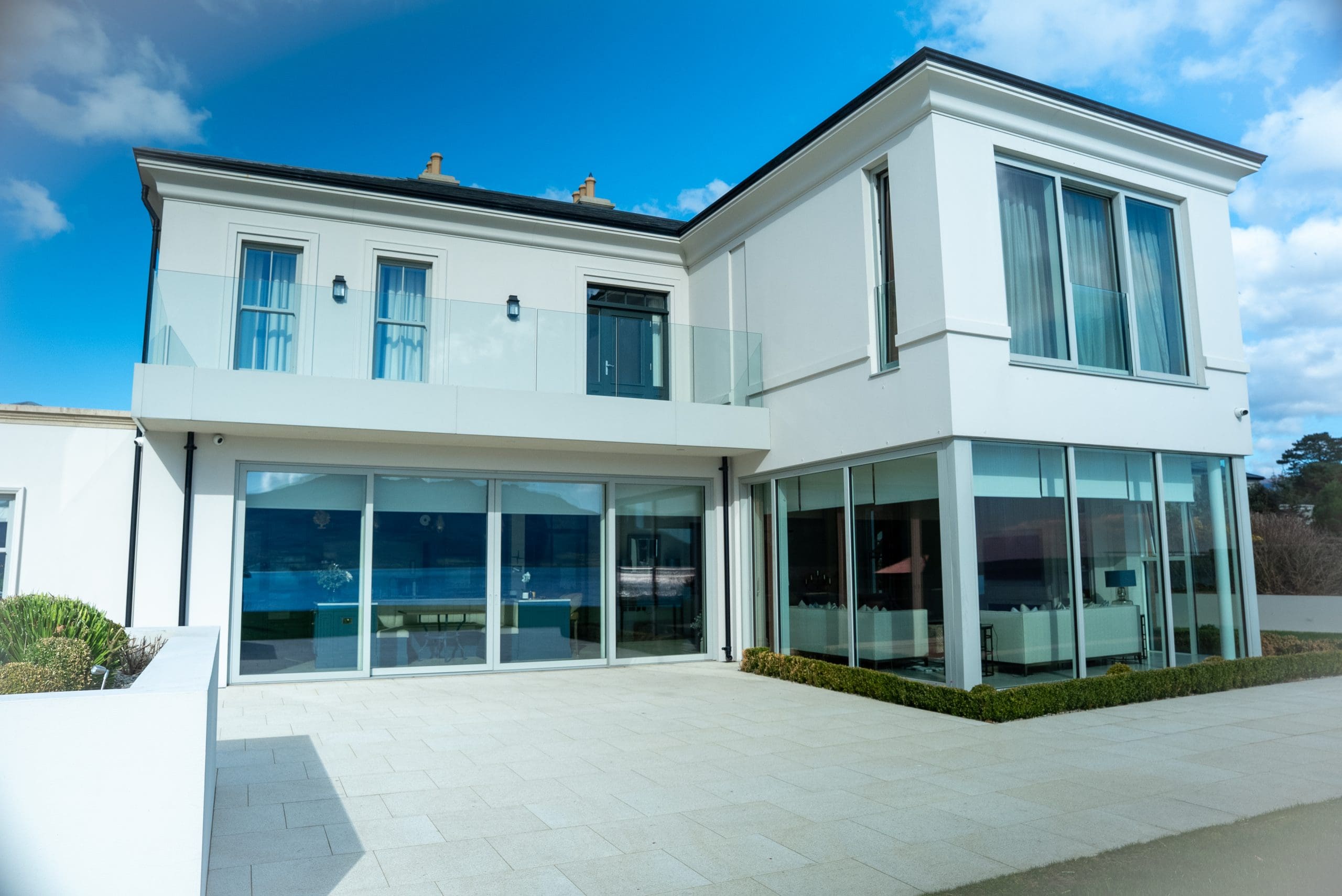 large house with automated shades for added security